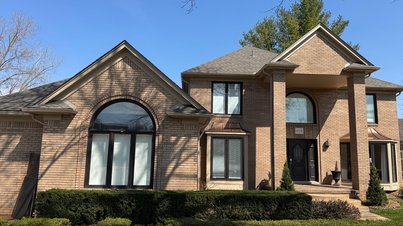 Window cleaning service at a two-story home in Washington Township, MI